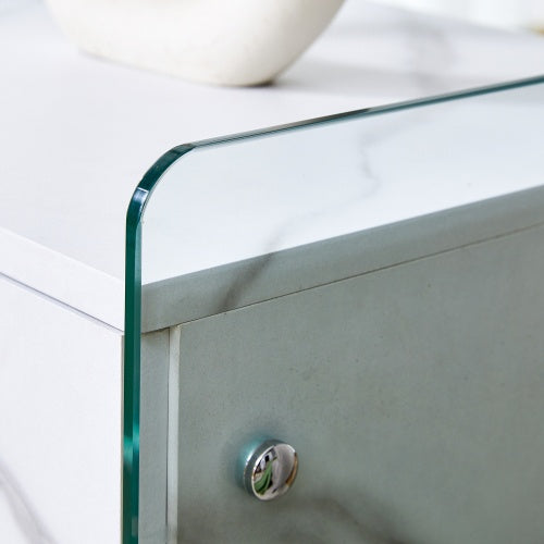 Bedside Table With Drawers. The Board Surface Is MDF Sticker, And Both Sides Are Transparent Tempered Glass. The Design Is Simple And Elegant, With Excellent Storage Functions