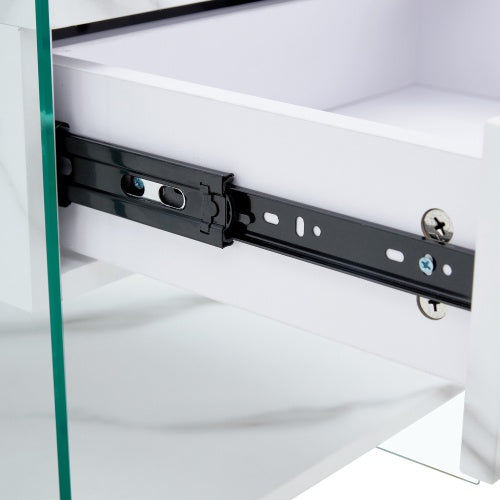 Bedside Table With Drawers. The Board Surface Is MDF Sticker, And Both Sides Are Transparent Tempered Glass. The Design Is Simple And Elegant, With Excellent Storage Functions