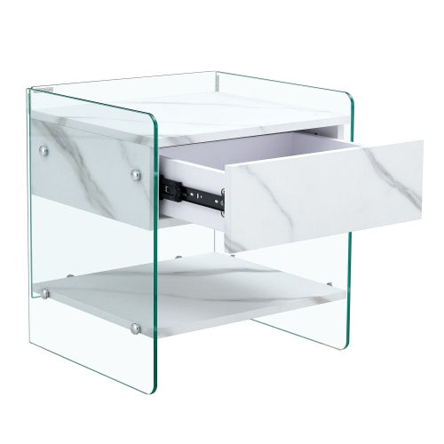 Bedside Table With Drawers. The Board Surface Is MDF Sticker, And Both Sides Are Transparent Tempered Glass. The Design Is Simple And Elegant, With Excellent Storage Functions
