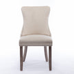 A A Upholstered Wing-Back Chair With Nailhead Trim & Solid Wood Leg